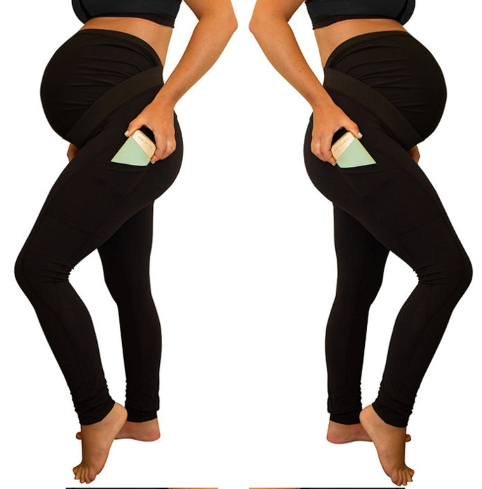 Pantalon de maternité à panneau de couleur pure, taille longue et haute, avec poches latérales