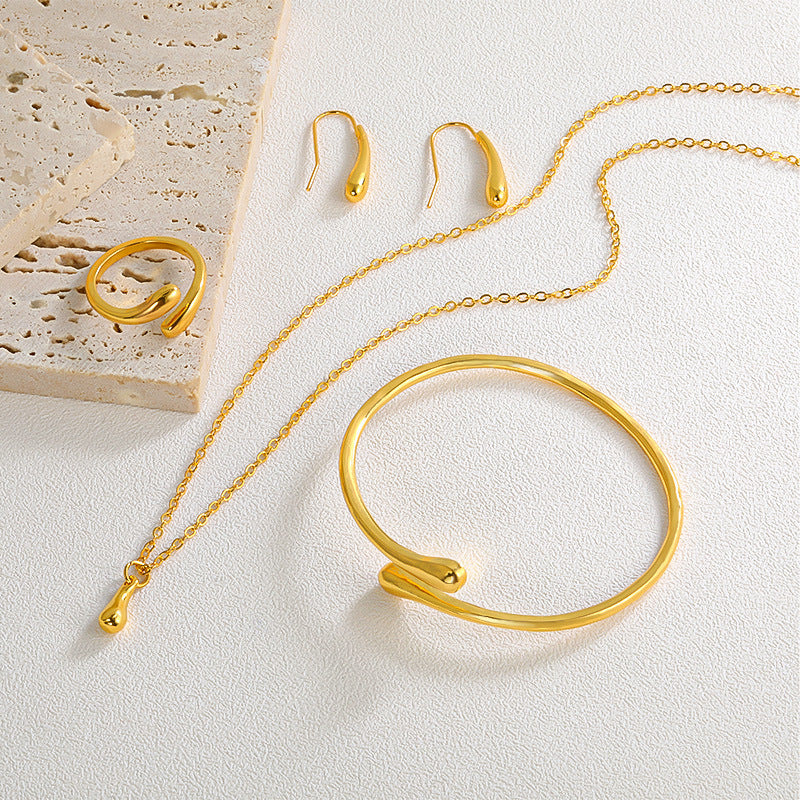 Ensemble collier, boucles d'oreilles, bague, bracelet en forme de goutte, quatre pièces