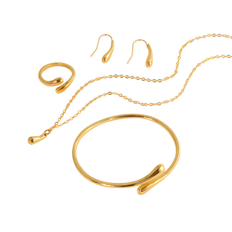 Ensemble collier, boucles d'oreilles, bague, bracelet en forme de goutte, quatre pièces